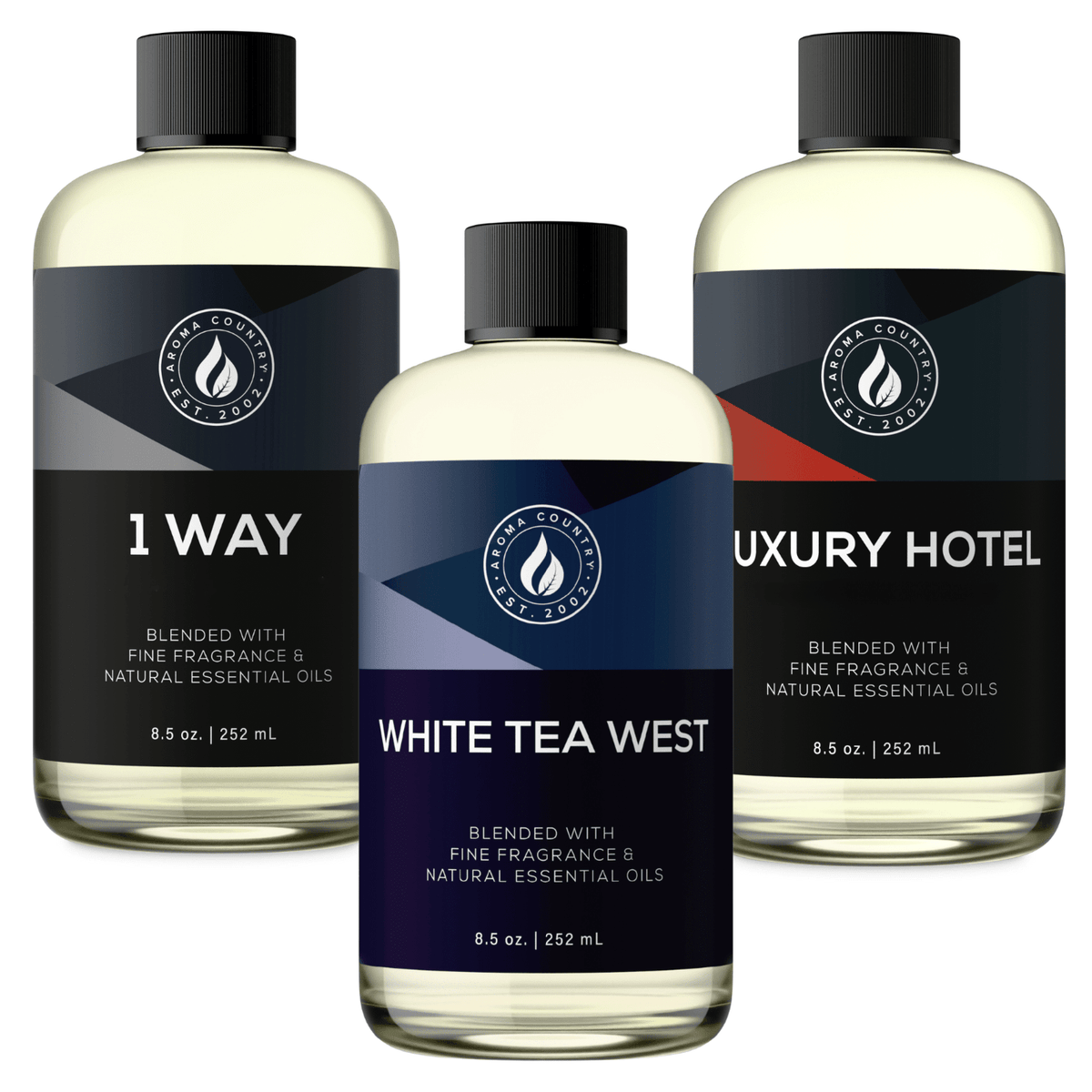 Three 8.5 oz hotel-inspired fragrance oils featuring 1 Way, White Tea West, and Luxury Hotel, a curated bundle of signature lobby-style scents for refined whole-home ambiance